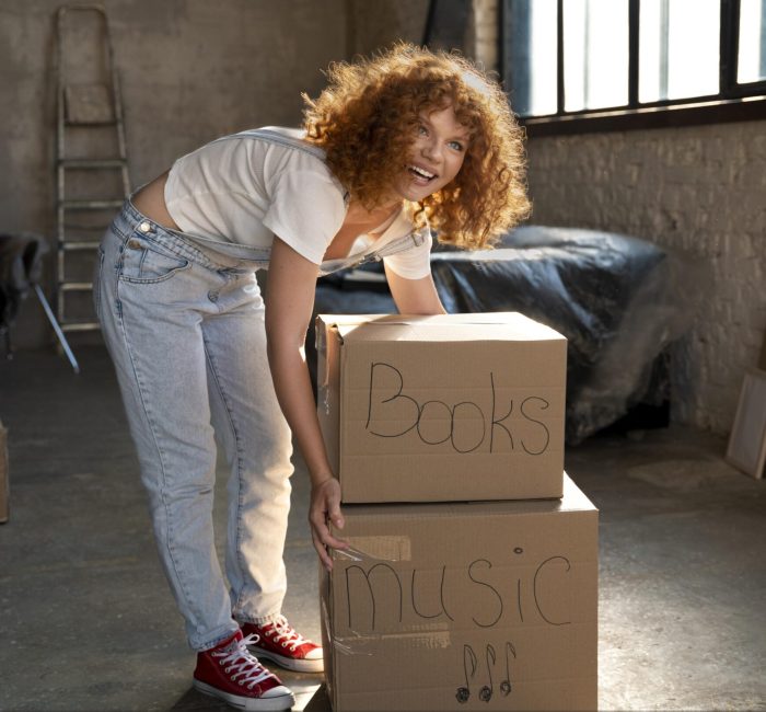 woman-handling-belongings-cardboard-boxes-moving-new-house (2)
